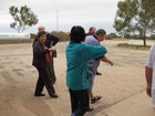 IMG_1893  The 'Aussie wave' at Wooramel Roadhouse.  The only place we enountered the famous Aussie flies.JPG