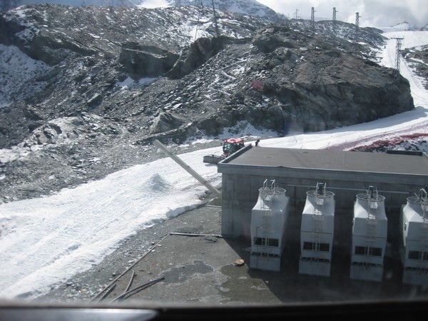 n_img_3529_artificial_snow_maker__up_slanted_large_white_pipe_to_the_left_of_the_building__and_groomer.jpg