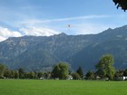 IMG_3937 Many paragliders fly from the high peaks to the flat valley bottom.JPG