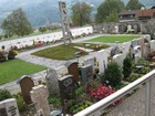 IMG_4060 Swiss cemeteries tend to be compact and decorative. The graves extend under the walkways.JPG