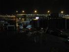 IMG_4249 Leaving Newark, NY for Moncton at 7 PM. Jetway 105 looks like a long necked animal eating our little aricraft.JPG