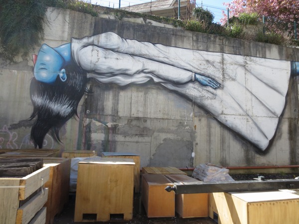 n_img_2861__wall_painting_in_a_vacant_lot_behind_a_fence_with_a_peek_hole.jpg