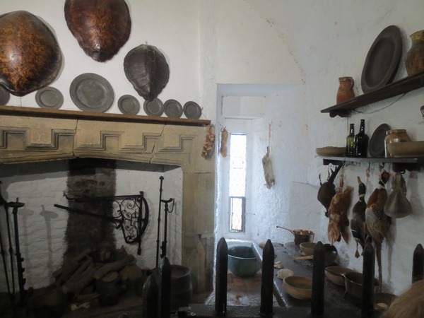 n_img_3399__bunratty_castle___kitchen_with_turtle_shell_cooking_pans_above_the_fireplace.jpg