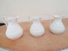 IMG_3778  Three stages.  Left, greenware; middle, biscuit, has shuink by 15%; right, finished glaze.JPG
